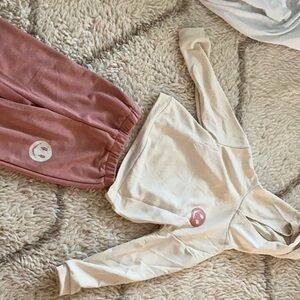 Pink pant and white top with smiley face in the front